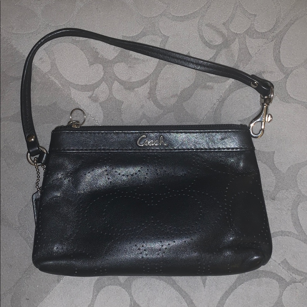 Coach leather perforated wristlet.